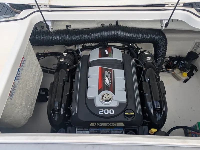Slide: The Image of The engine compartment of a 2023 Bayliner VR4 Bowrider features a 200 HP engine. - 15