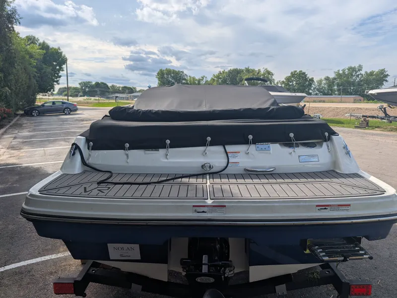 Slide: The Image of The image shows the rear of a 2023 Bayliner VR4 Bowrider, parked on a trailer. - 5