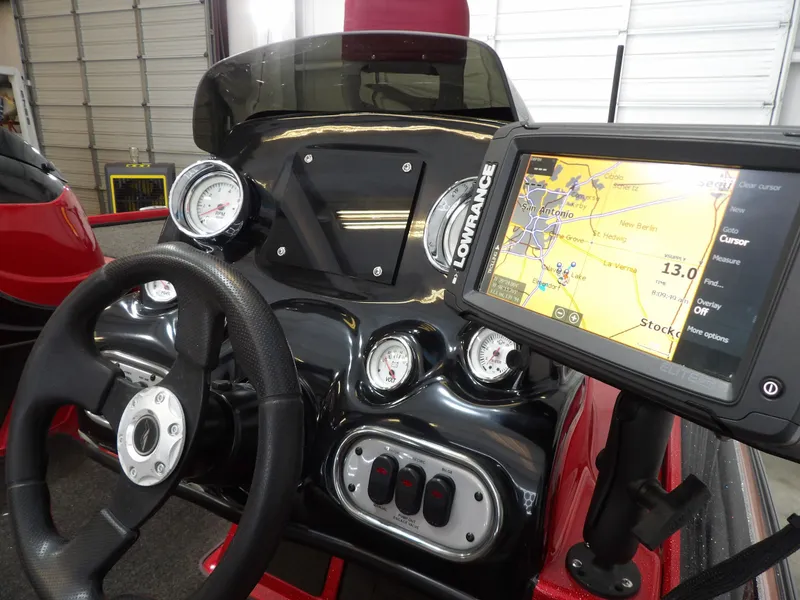 Slide: The Image of The image shows the cockpit of a 2010 Nitro Z-7 boat with a Lowrance navigation system. - 6
