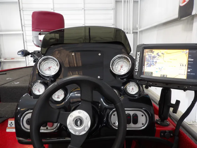Slide: The Image of The image shows the cockpit of a 2010 Nitro Z-7 boat with a Lowrance navigation system. - 20
