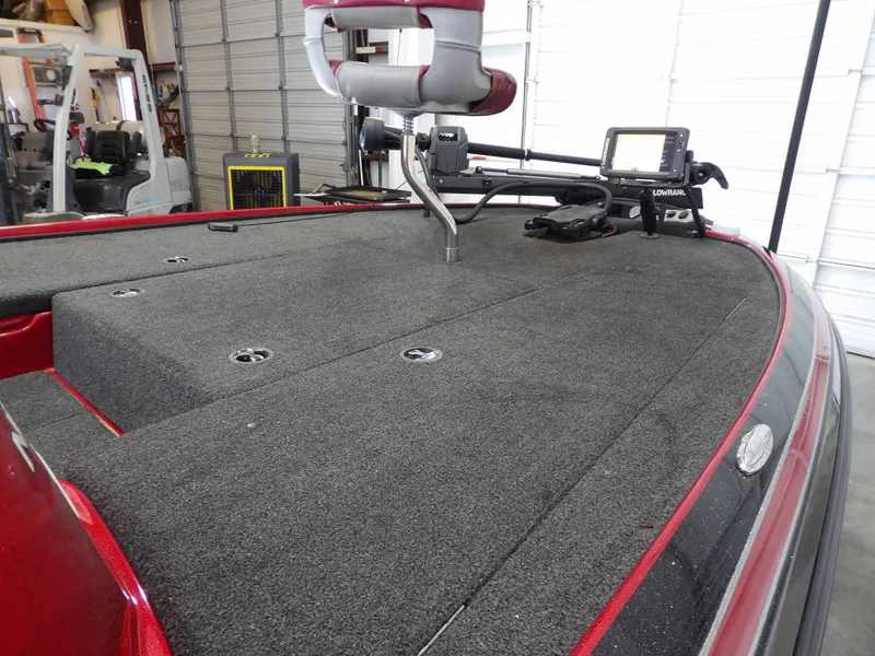 Slide: The Image of The image shows the deck of a 2010 Nitro Z-7 boat with gray carpeting. - 21