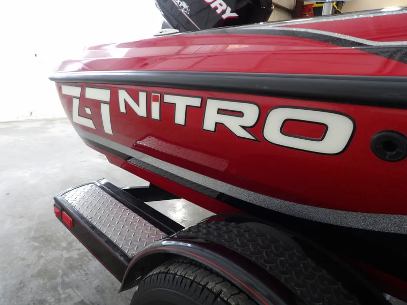 Slide: The Image of Red Nitro Z-7 boat from 2010 on a trailer, featuring a bold logo on the side. - 24