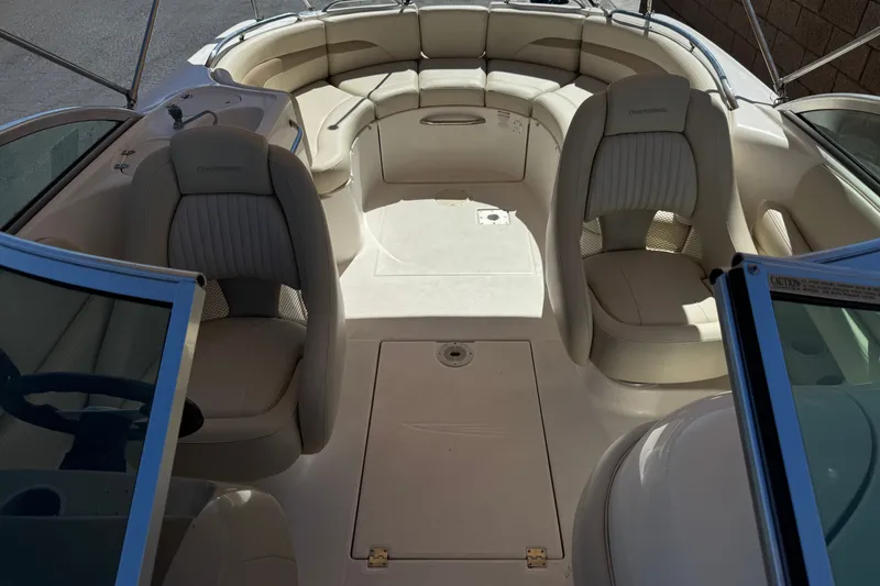 Slide: The Image of Interior view of 2003 Chaparral Sunesta 263 boat with beige seating and open deck. - 18