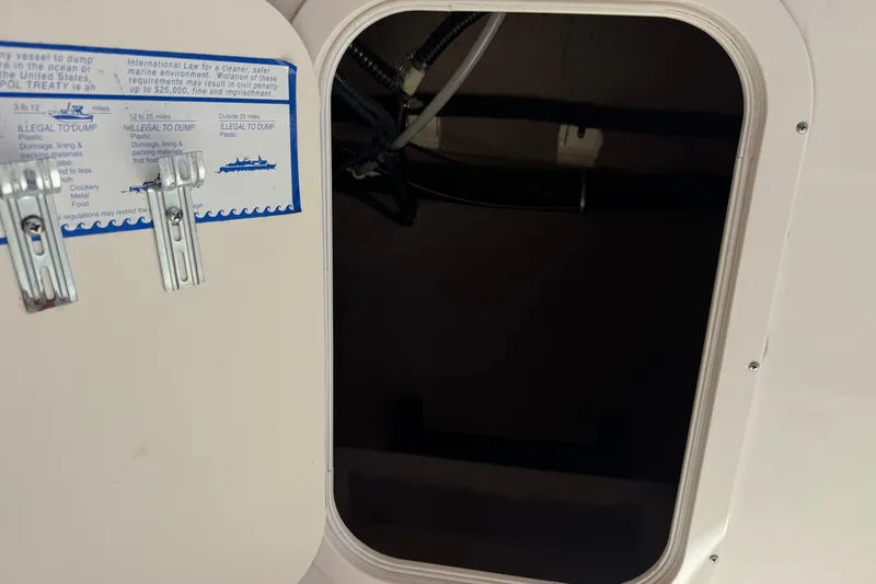 Slide: The Image of Open hatch on 2003 Chaparral Sunesta 263 boat, showing interior compartment. - 27