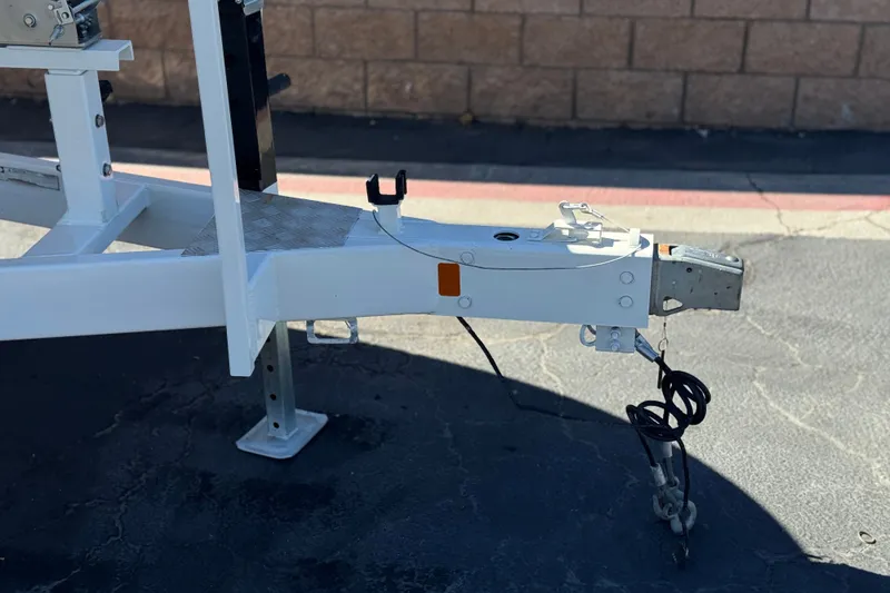 Slide: The Image of Trailer hitch of a 2003 Chaparral Sunesta 263 boat on pavement. - 39
