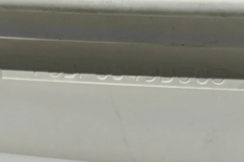 Slide: The Image of Close-up of a 2003 Chaparral Sunesta 263 hull identification number. - 40