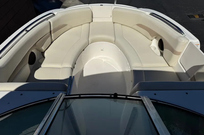 Slide: The Image of 2003 Chaparral Sunesta 263 boat interior with spacious seating and sleek design. - 13