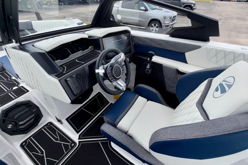 Slide: The Image of 2027 Tigé 24RZX boat interior with modern dashboard and luxurious seating. - 36