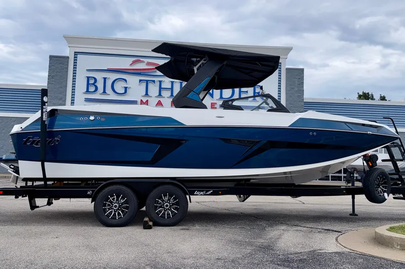 The Image of 2027 Tigé 24RZX boat on trailer at Big Thunder Marine dealership. - 1
