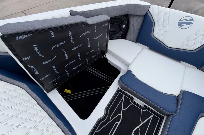 Slide: The Image of Interior of 2027 Tigé 24RZX boat with open storage compartment and stylish seating. - 43