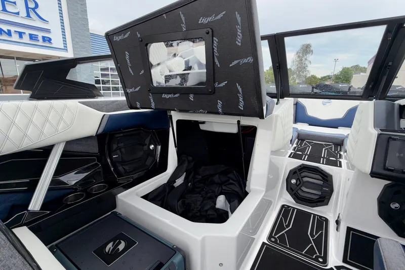 Slide: The Image of 2027 Tigé 24RZX boat interior with modern seating and storage compartments. - 32