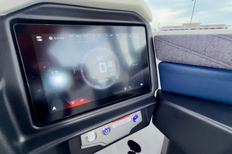 Slide: The Image of Dashboard display of 2027 Tigé 24RZX boat with digital controls and settings. - 37