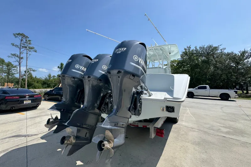 Slide: The Image of 2014 Yellowfin 39 Offshore boat with triple Yamaha 350 engines on a trailer. - 18