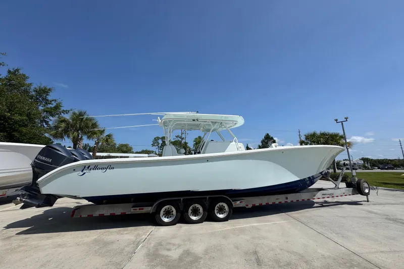 Slide: The Image of 2014 Yellowfin 39 Offshore boat on trailer under clear blue sky. - 14
