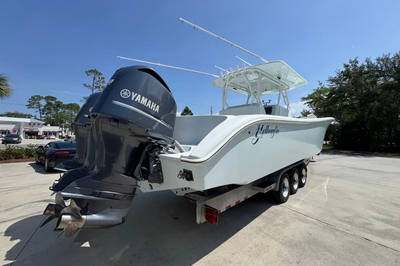 Slide: The Image of 2014 Yellowfin 39 Offshore boat with Yamaha outboard engines on a trailer. - 17
