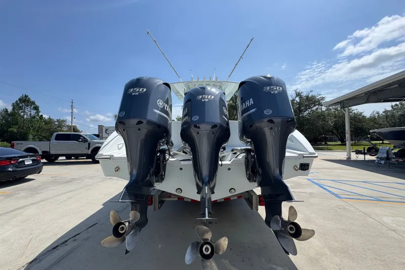 Slide: The Image of 2014 Yellowfin 39 Offshore boat with triple Yamaha 350 V8 engines, parked outdoors. - 20