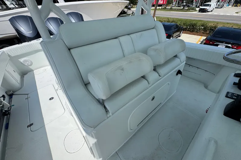 Slide: The Image of 2014 Yellowfin 39 Offshore boat interior with white seating and helm area. - 34