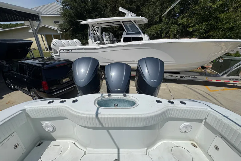 Slide: The Image of 2014 Yellowfin 39 Offshore boat with triple outboard engines, parked on a trailer. - 43