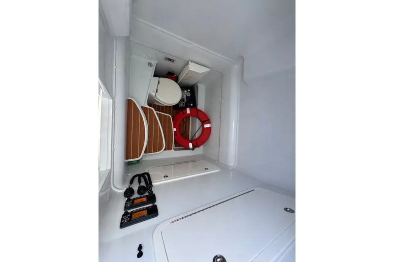 Slide: The Image of 2014 Yellowfin 39 Offshore boat interior with life preserver and radio equipment. - 30