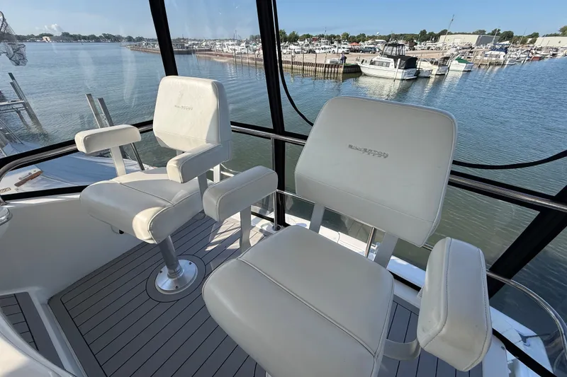 Slide: The Image of Luxury seating on 2000 Silverton 42 Convertible yacht overlooking marina. - 51