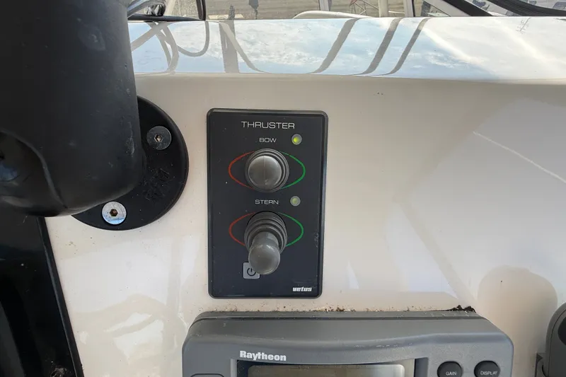 Slide: The Image of Control panel of a 2000 Silverton 42 Convertible boat with bow and stern thruster controls. - 57