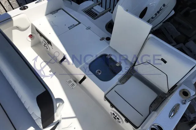 Slide: The Image of The image shows the cockpit of a 2027 Stingray 17 CC boat with a Suzuki outboard motor. - 7