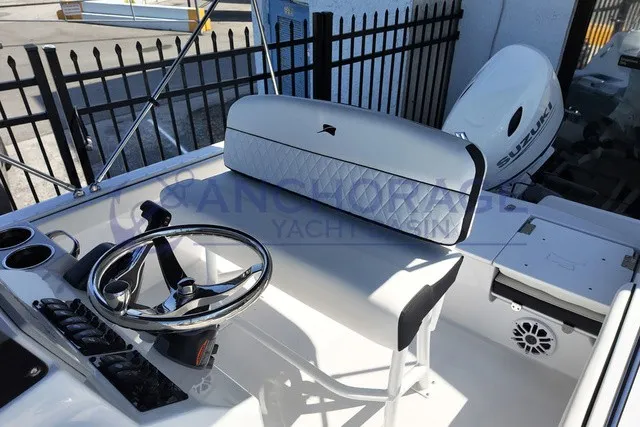 Slide: The Image of The image shows the cockpit of a Stingray 17 CC boat with a Suzuki outboard motor. - 6