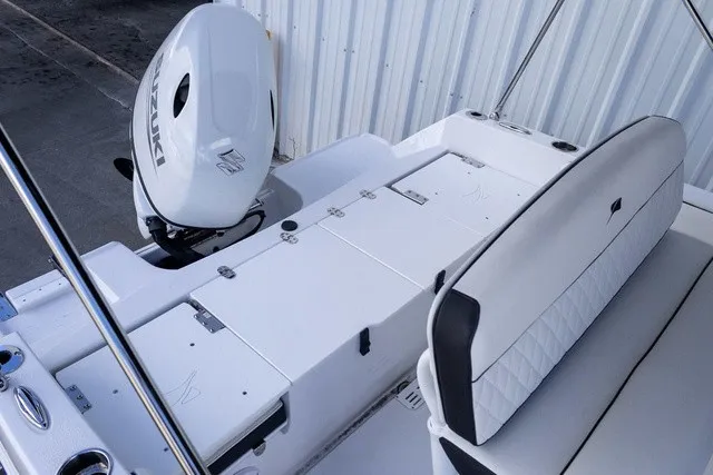 Slide: The Image of The image shows the stern of a Stingray 17 CC boat with an outboard motor. - 10