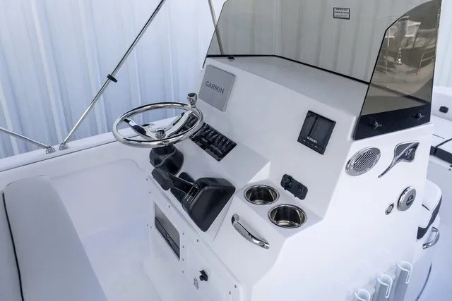 Slide: The Image of The image shows the helm of a 2027 Stingray 17 CC boat with modern instruments. - 8