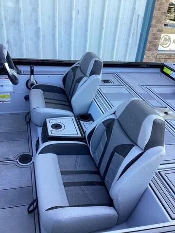 Slide: The Image of Two cushioned seats in a modern boat with gray and black accents. - 12