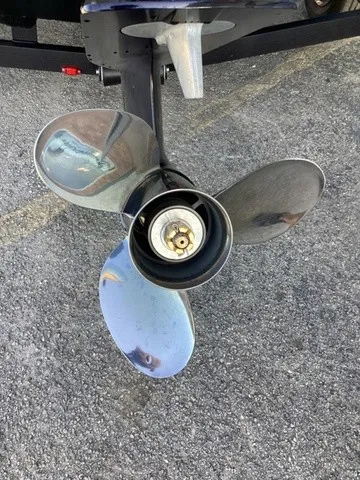 Slide: The Image of Close-up of a shiny three-blade propeller on asphalt. - 3