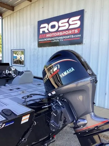Slide: The Image of A G3 Sportsman 1810 SE boat with a Yamaha outboard motor, parked in front of a Ross Motorsports sign. - 6