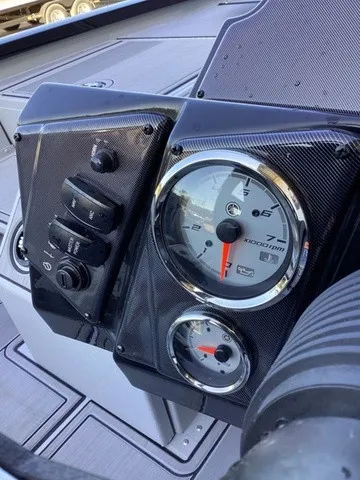 Slide: The Image of Close-up of a G3 Sportsman 1810 SE dashboard with tachometer and switches. - 33