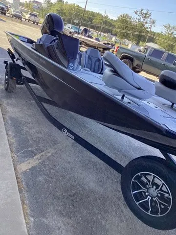 Slide: The Image of A G3 Sportsman 1810 SE boat on a trailer, parked in a lot. - 24