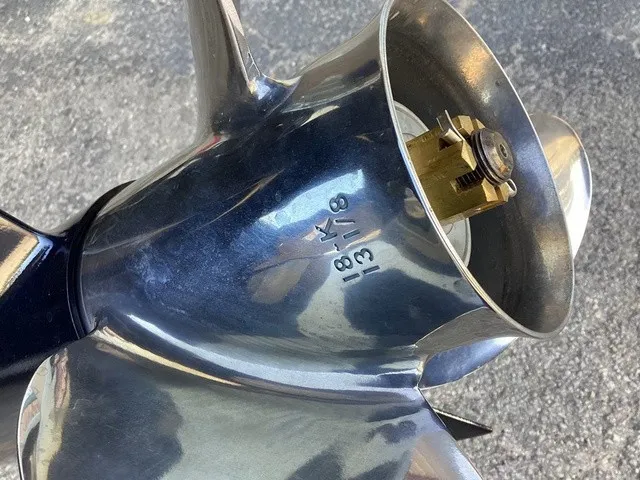 Slide: The Image of Close-up of a shiny boat propeller with engraving on the surface. - 4