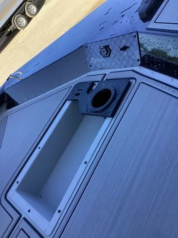 Slide: The Image of Close-up of a boat deck with storage compartment and mount. - 25