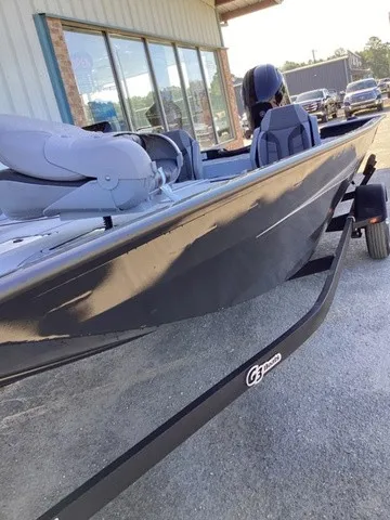 Slide: The Image of A 2026 G3 Sportsman 1810 SE boat on a trailer in front of a building. - 18