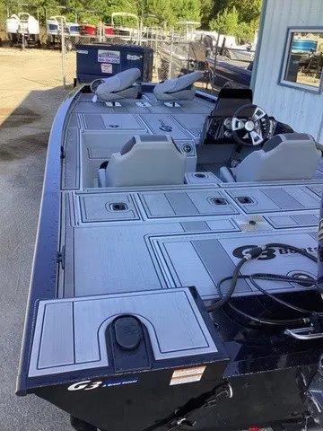 Slide: The Image of The image shows a G3 Sportsman 1810 SE boat with gray seats and a modern helm. - 36