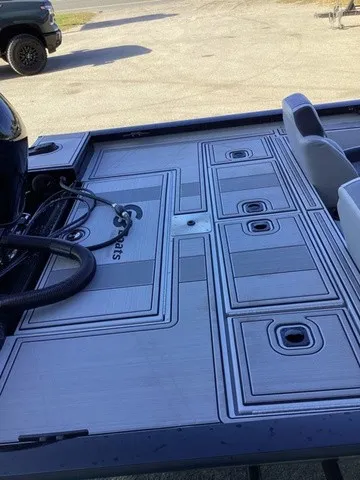 Slide: The Image of The image shows the deck of a G3 Sportsman 1810 SE boat with textured flooring. - 28