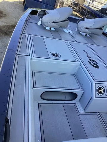 Slide: The Image of The image shows the deck of a G3 Sportsman 1810 SE boat with two seats. - 16