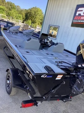 Slide: The Image of A G3 Sportsman 1810 SE boat on a trailer, featuring gray seats and an outboard motor. - 7