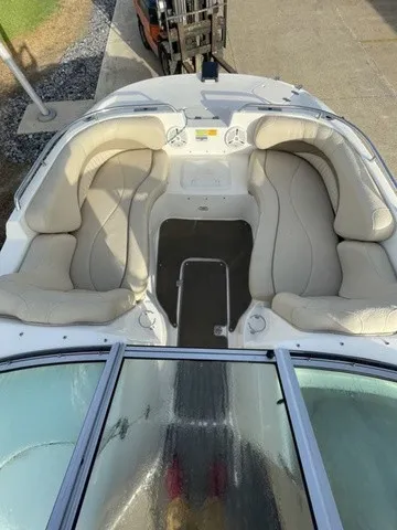 Slide: The Image of The image shows the cockpit of a 2008 NauticStar 232 D/C with beige cushioned seats. - 14
