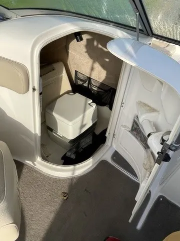 Slide: The Image of The image shows the interior of a boat with a small toilet in an enclosed area. - 16