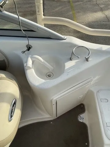 Slide: The Image of The image shows the cockpit of a 2008 NauticStar 232 D/C boat with a sink. - 15