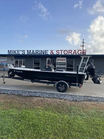 The Image of A black 2019 Topwater Skiffs FS190 boat on a trailer in front of a building. - 1