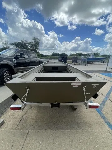 Slide: The Image of A G3 Gator Tough 1652 VBW boat on a trailer under a cloudy sky. - 3