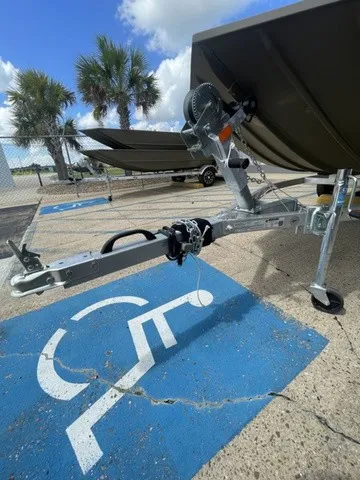 Slide: The Image of A G3 Gator Tough 1652 VBW boat on a trailer, parked in a handicapped spot. - 8