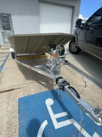 Slide: The Image of A G3 Gator Tough 1652 VBW boat on a trailer, parked in a handicap parking space. - 9