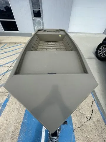 Slide: The Image of A sturdy aluminum flat-bottom boat, ideal for shallow waters and fishing. - 7