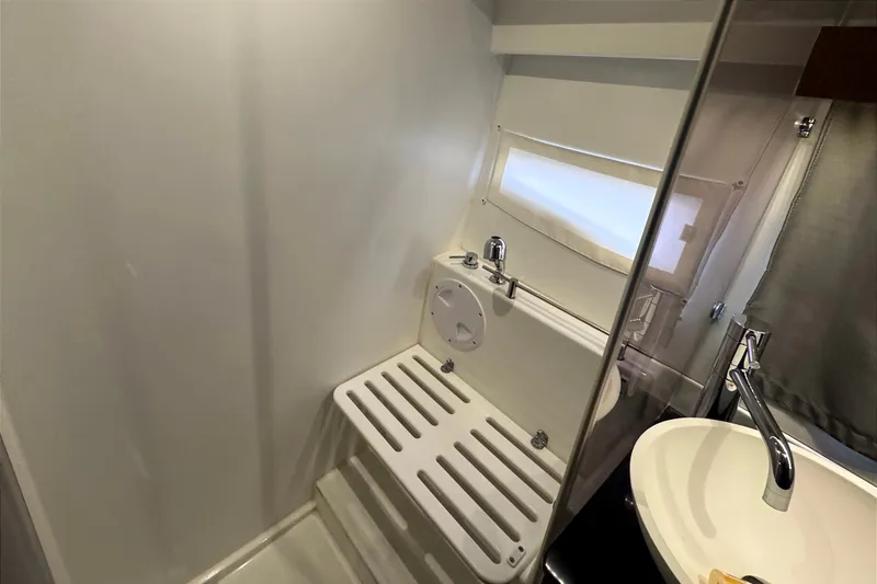 Slide: The Image of Bathroom interior of 2021 Jeanneau NC Weekender 1095 with sink and shower area. - 45